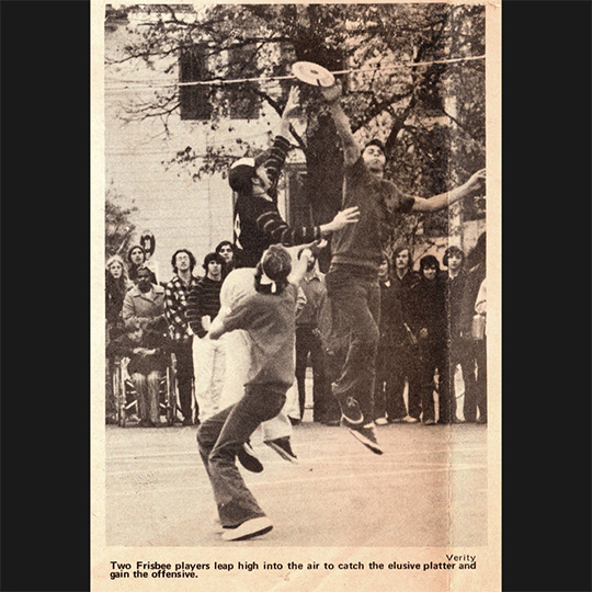 three-frisbee-players